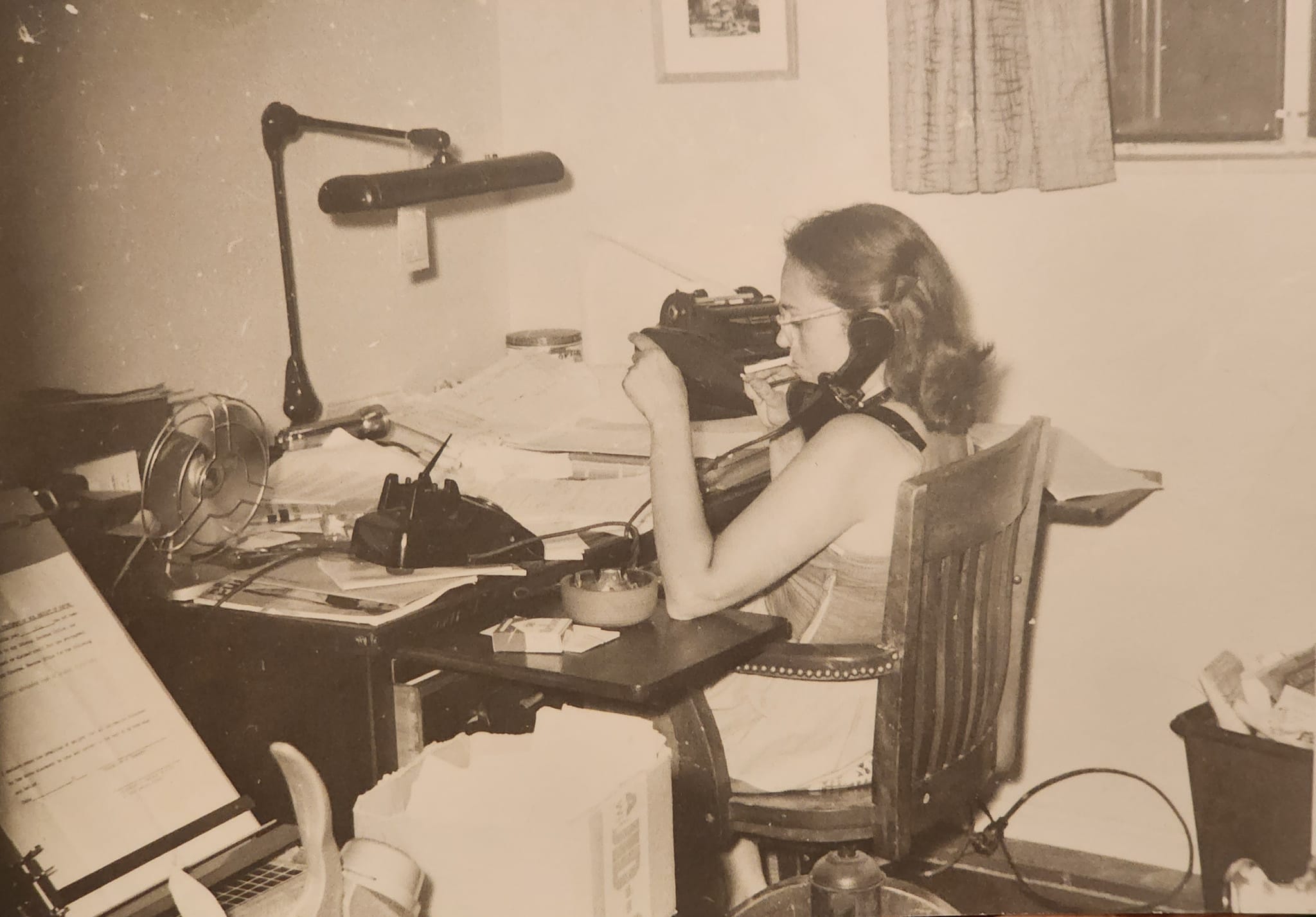 Charlene Eisenberg working at her desk, advocating for others